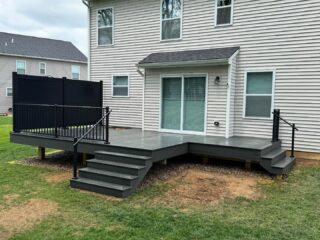 Trex decking with Westbury privacy panels and railing. Landscaping and hot tub to come!