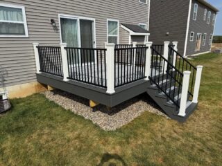 Trex naturals with Trex transcend posts and Westbury aluminum railing.